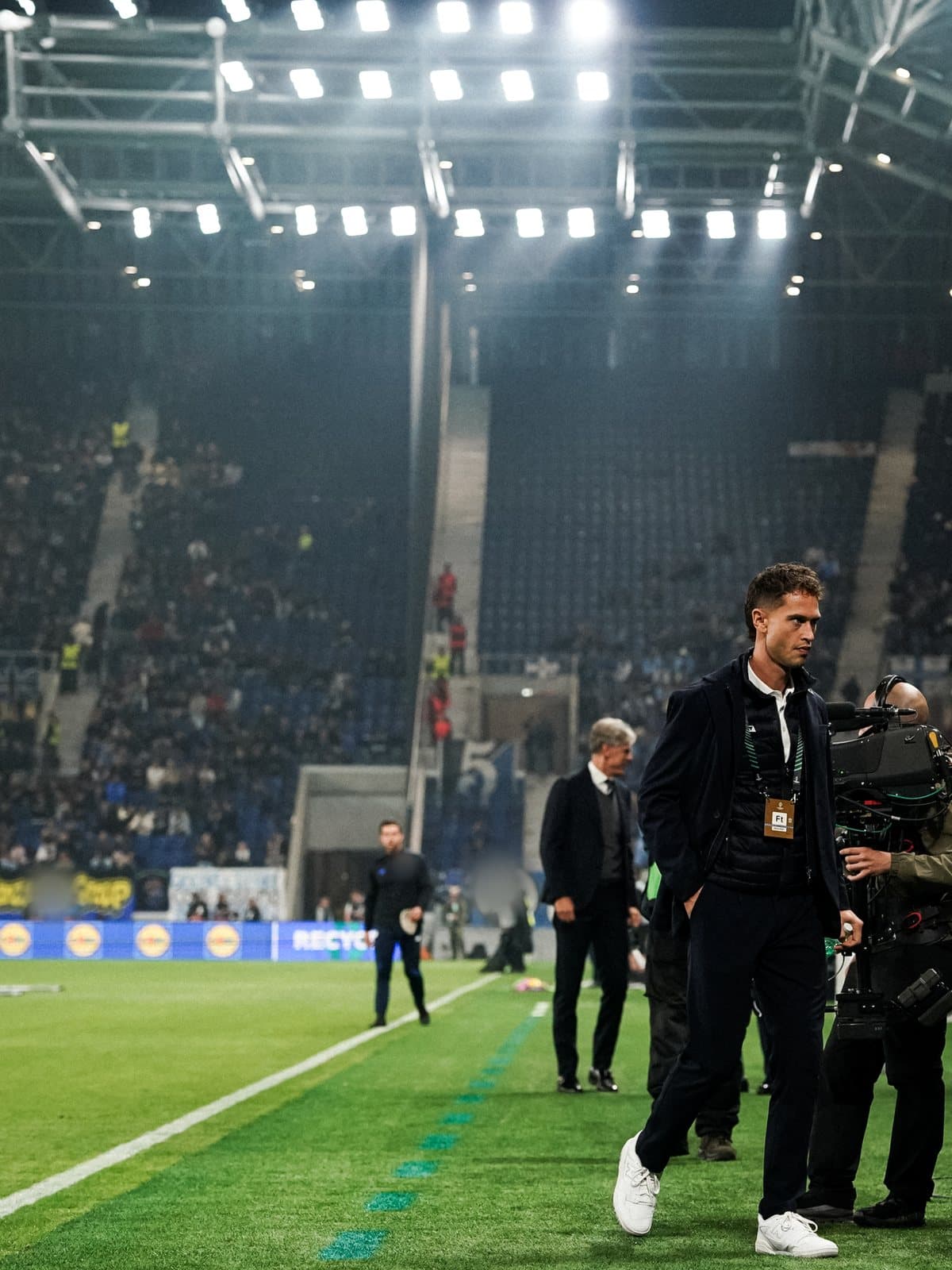 Francesco Palvarini pitchside in a stadium before a match